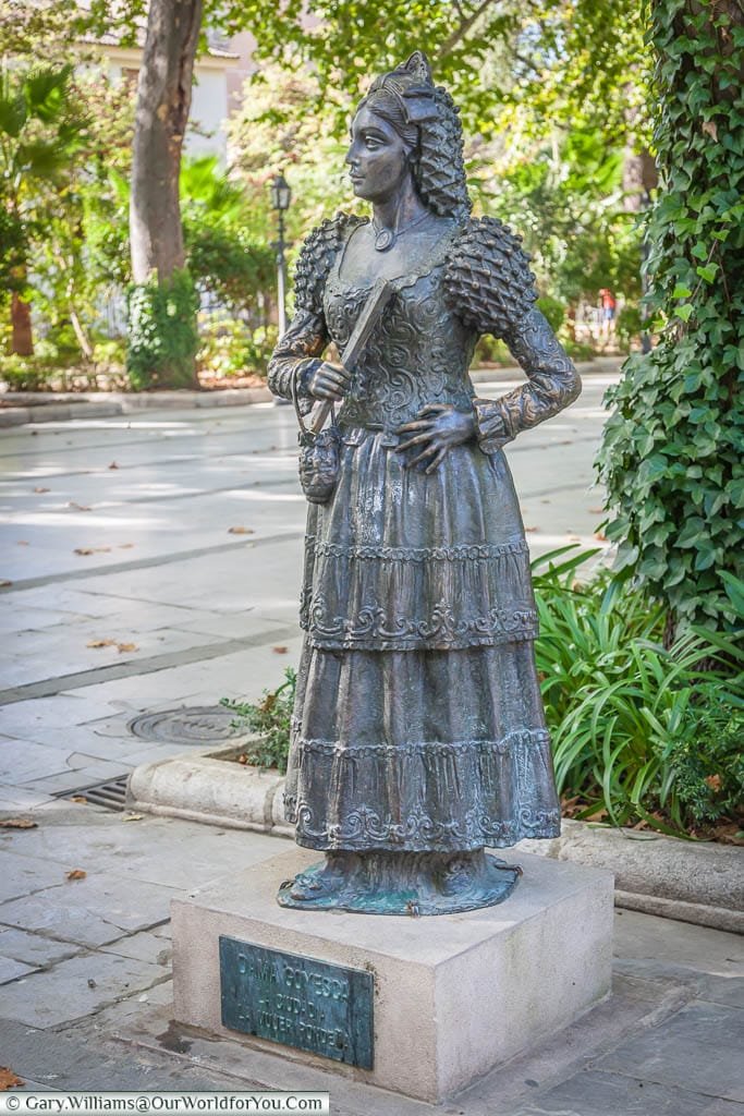 A statue to the Dames Goyesca, in traditional dress outside the bullring in  Ronda, Spain.  The ladies of Ronda have been the official representatives of the city since the 1950s