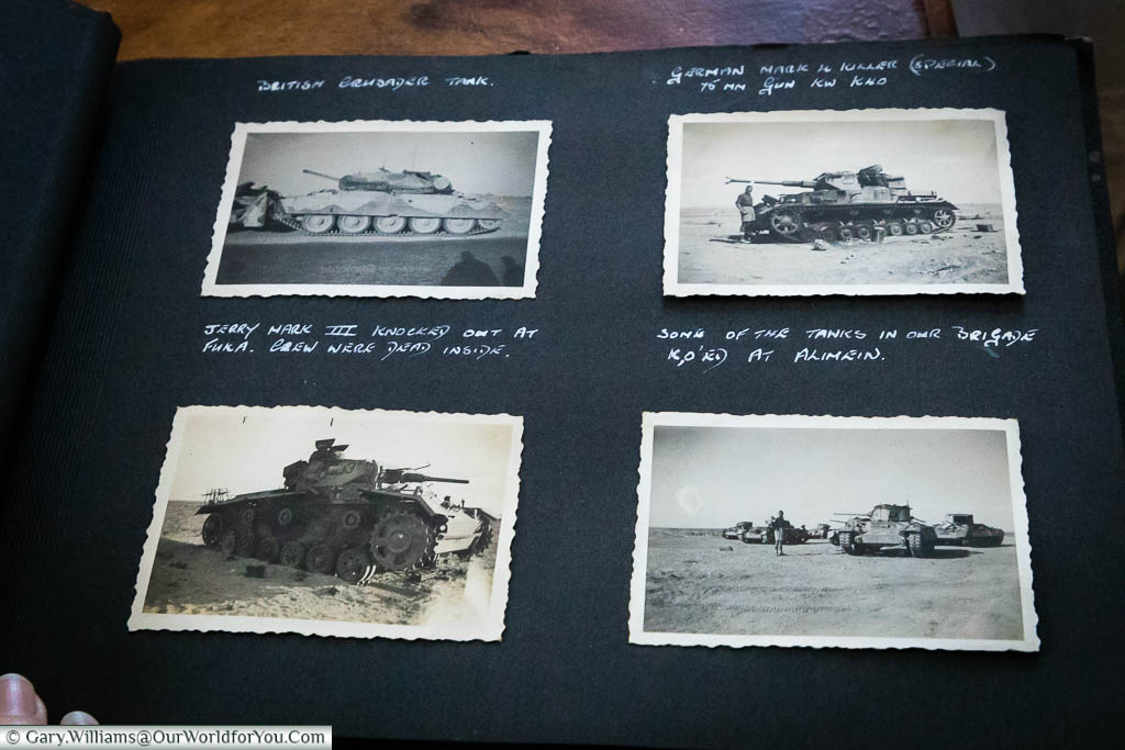 A page from the photo album with four shots of tanks from both sides