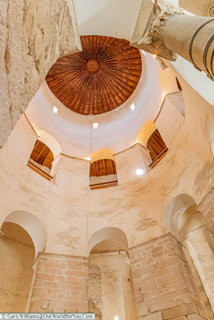 A view of the pillars inside the 9th century St Donatus Church in Zadar, looking up towards the wooden domed roof.