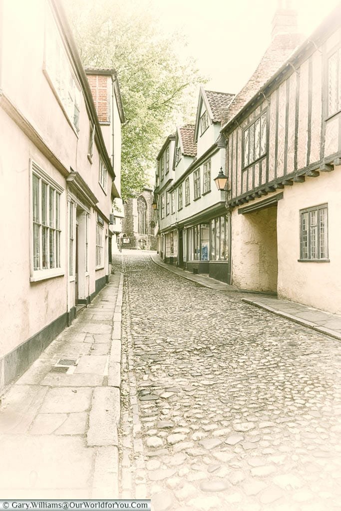 A vintage styled shot of a cobbled lane in Elm Hill, in the city of Norwich, Norfolk, England