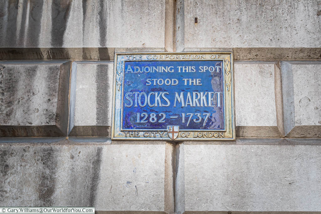 A blue enamel plaque recognising the spot there the ancient Stocks Market stood
