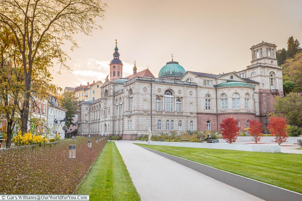 The classic architecture of the Friedrichsbad bathing palace, under a golden sky of dusk