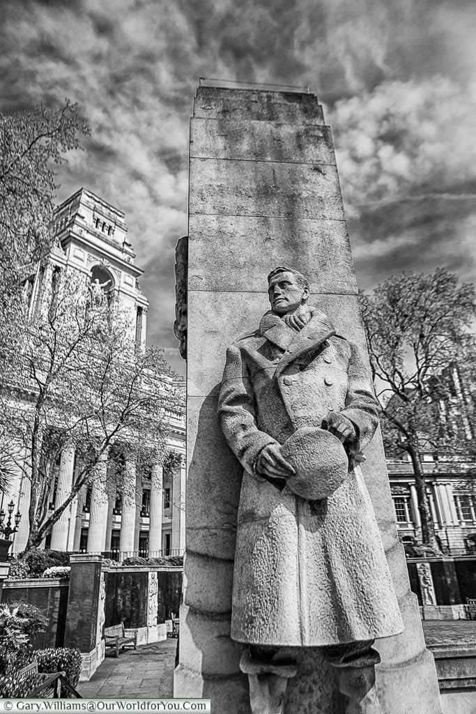 A black & white image of one of the stone Naval Officers at the Tower Hill Memorial in Trinity Memorial Gardens on Tower Hill