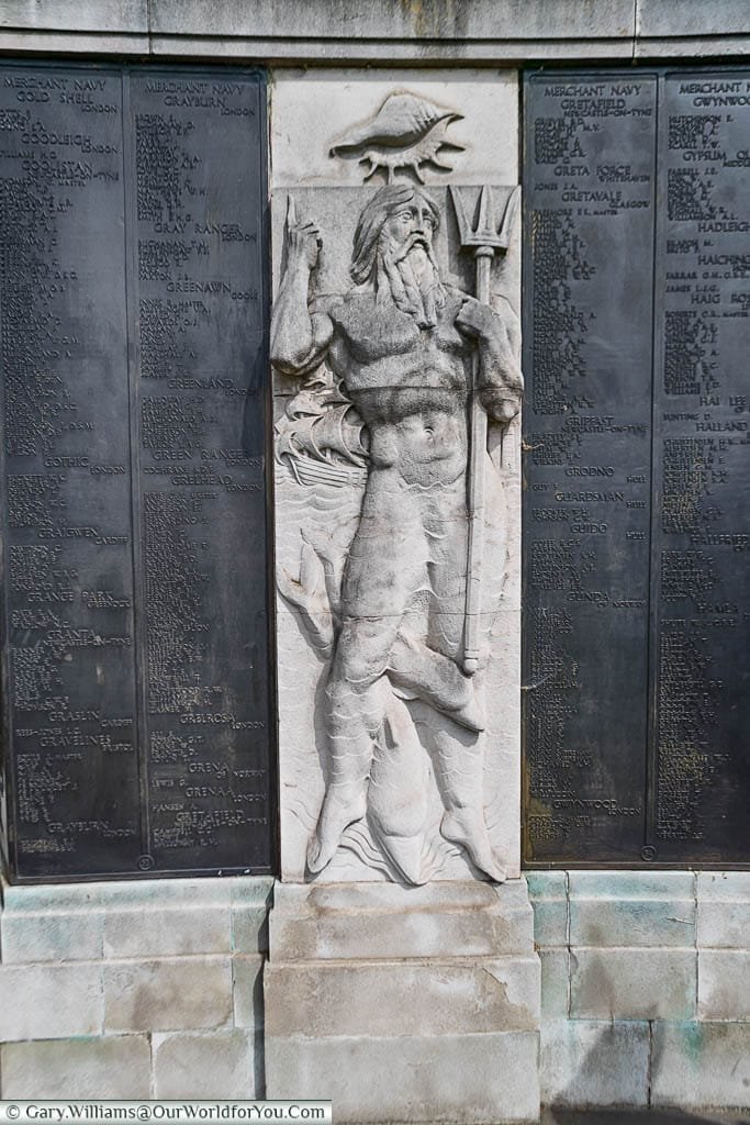 A base relief of Neptune between the list of the fallen at the Tower Hill Memorial in Trinity Memorial Gardens on Tower Hill