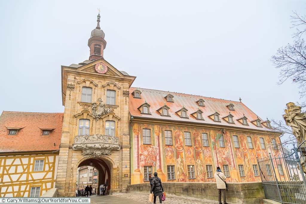 The old town hall of Bamberg, or Altes Rathaus Bamberg. A Baroque-style building decorated with large frescos on the external walls.