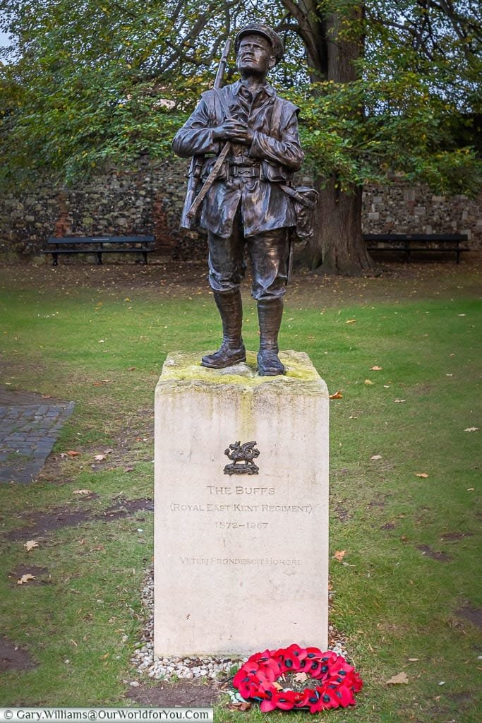 A bronze statue of a soldier from The Buffs in the Cathedral precinct