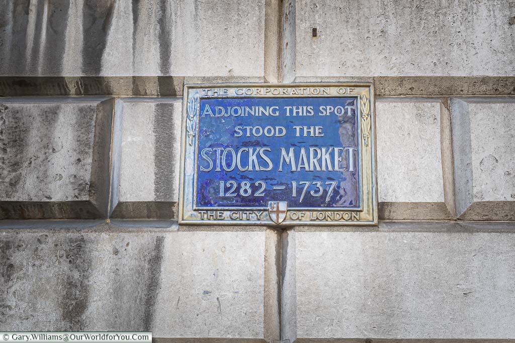 A blue enamel plaque recognising the spot there the ancient Stocks Market stood