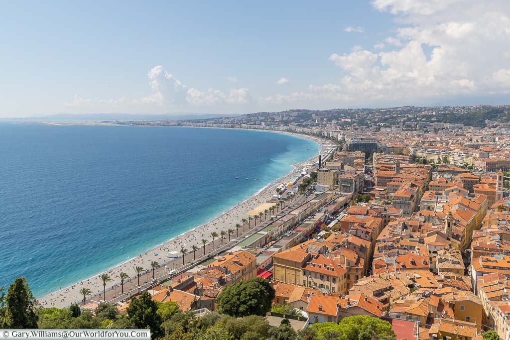Overlooking Nice from Castle Hill with the sparkling azure waters of the French Riviera on the left and the orange tiled roofs of the old town to the right.