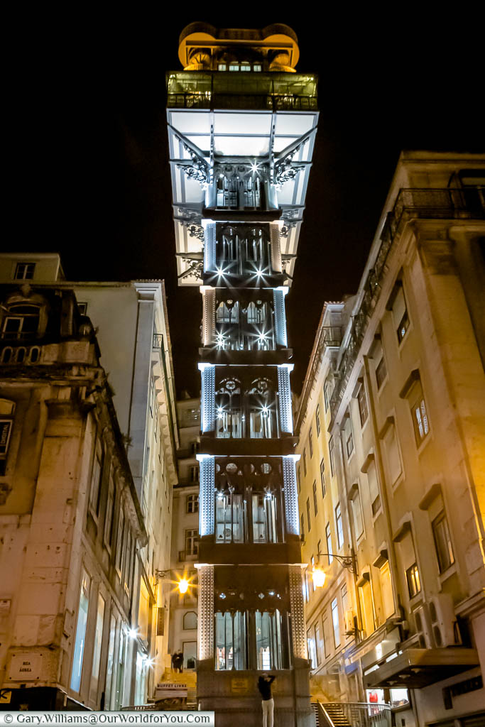 The elegant art deco iron structure of the Elevador de Santa Justa at night in Lisbon, Portugal