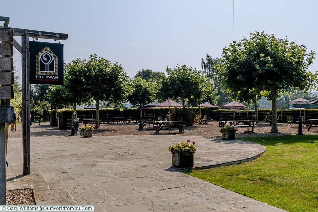 A large picnic area with tables & benches covered with branded parasols for you to enjoy a glass or two of your favourite Chapel Down or Curious Brew.