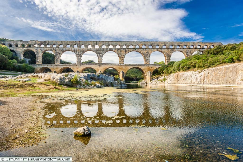 From the river's edge, a fine view of the Pont du Gard, France