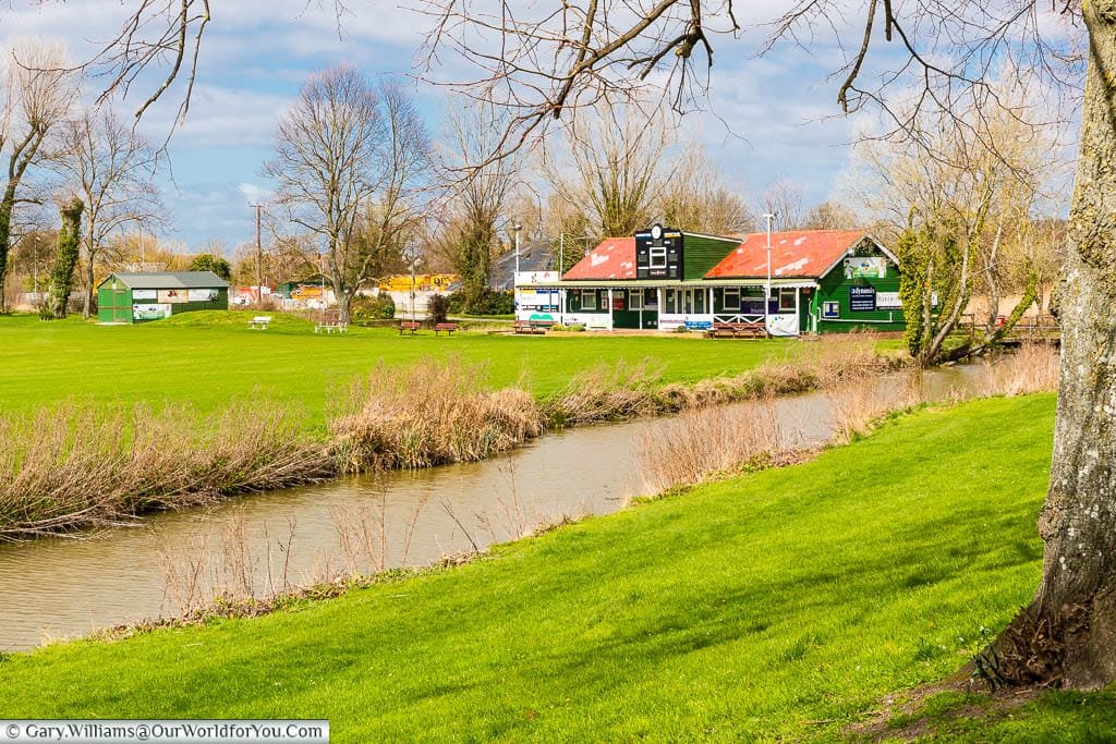 The cricket pitch and pavilion of Sandwich Town Cricket Club alongside The Butts, or the Old town wall of Sandwich