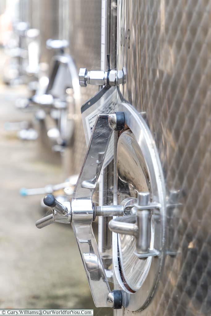 A close-up shot of one of the large stainless steel wine vats for holding the pressed grape juice and it takes it's a journey to becoming a Chapel Down wine.