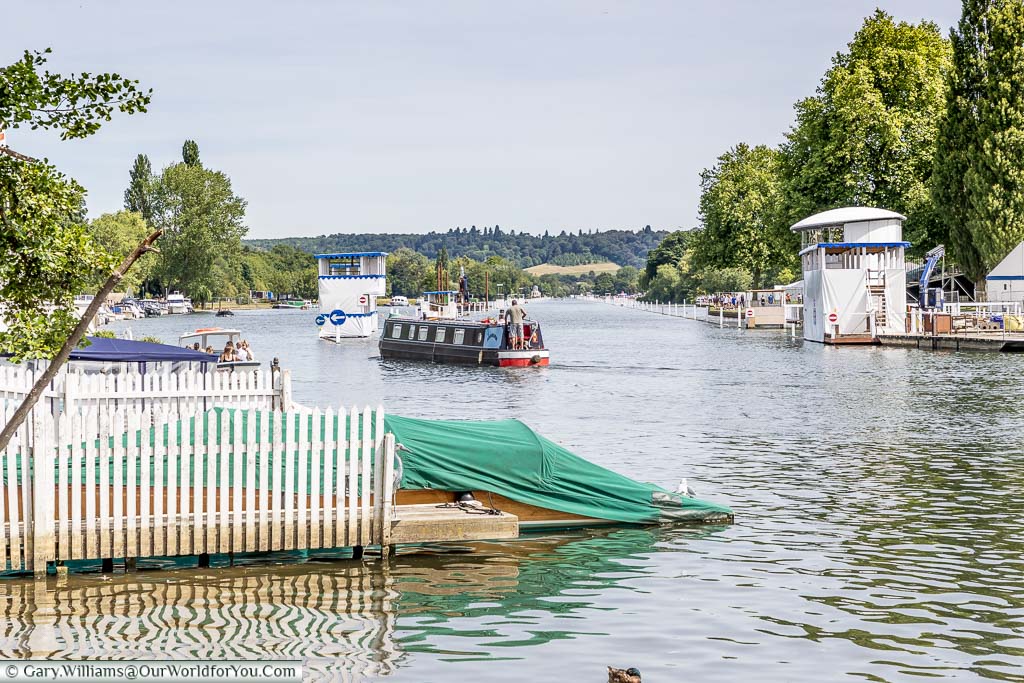 A canal boat chugging along the River Thames prepared for the Henley Royal Regatta