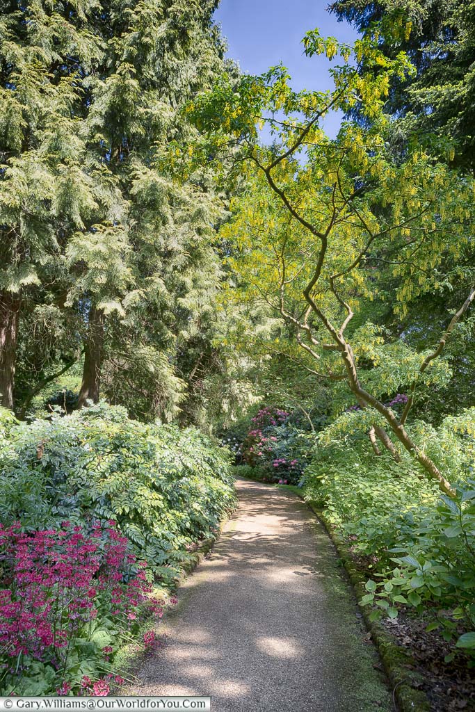 A path running through beautifully kept gardens at Sandringham House, Norfolk