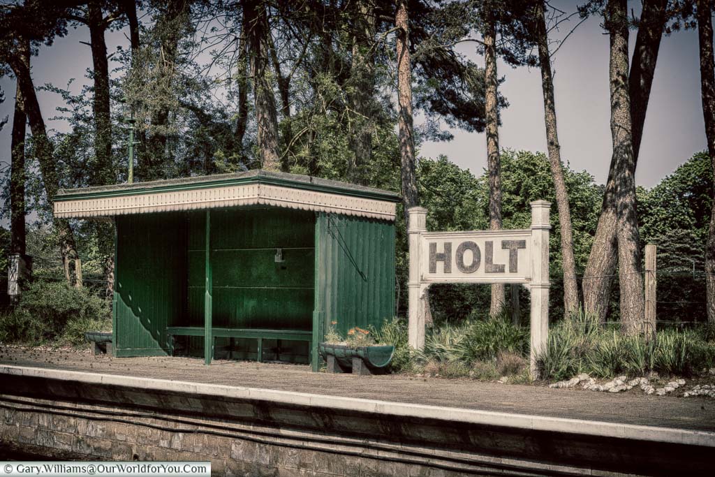 A vintage shelter, in a green & cream paint scheme, at Holt station on the North Norfolk Railway line.