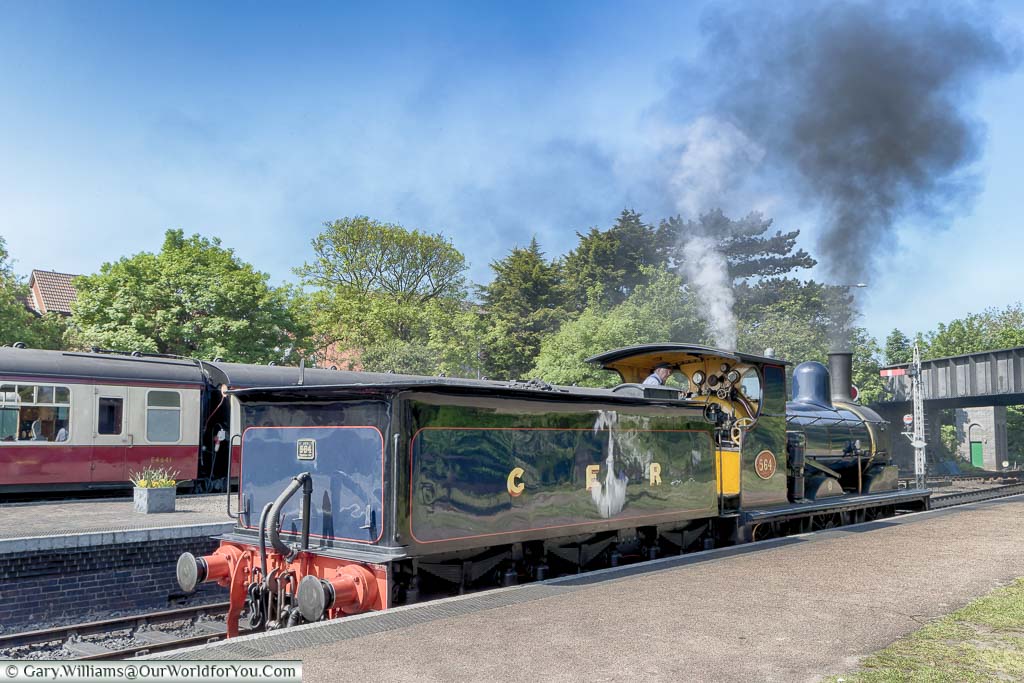 A steam locomotive from the North Norfolk Railway Line preparing to leave the platform at Sheringham Station.