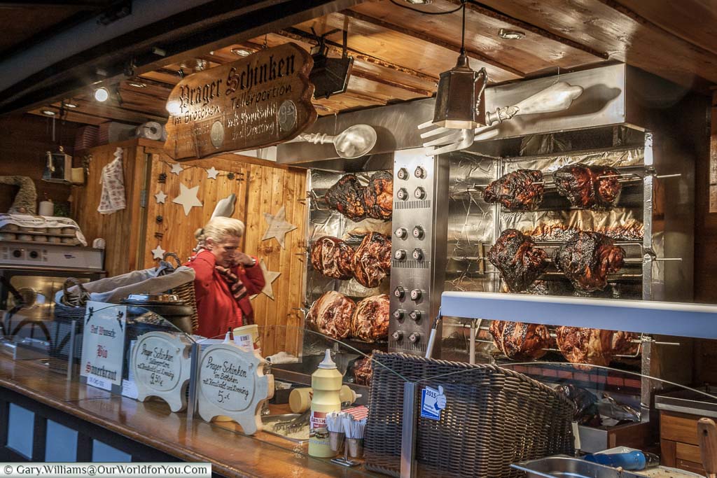 Pork joints roasting on a Christmas market stall in Cologne
