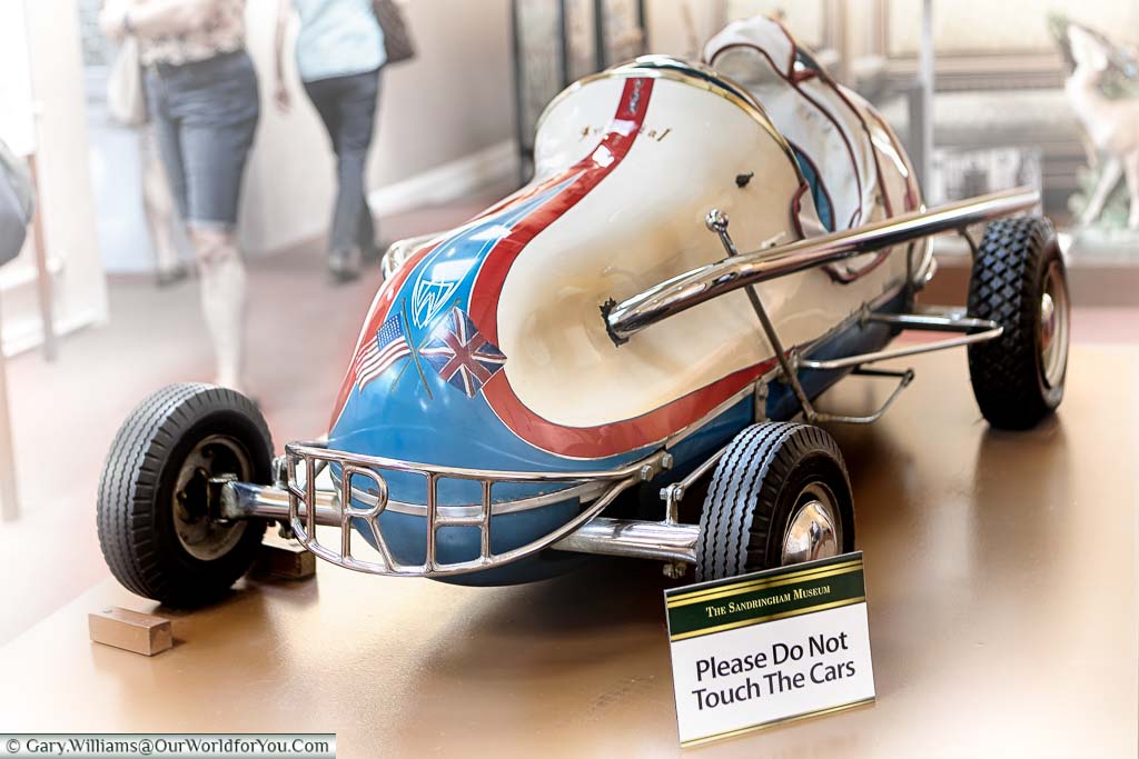 A vintage toy race car for the Princes' to sit in, in the Sandringham Museum