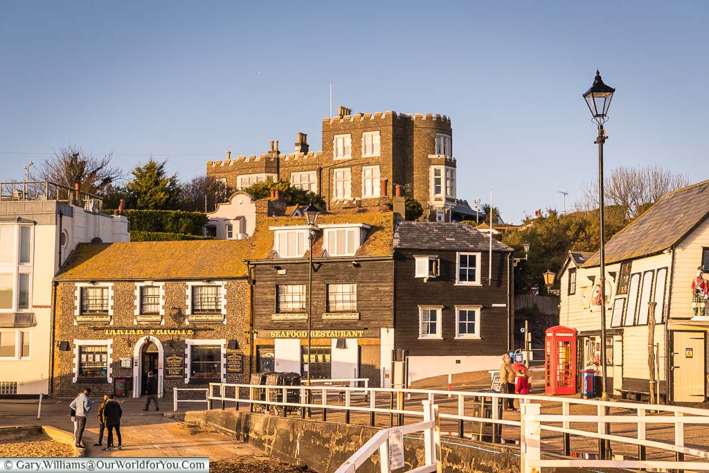 The view from the Harbour towards the Tartar Frigate pub with Bleak House on the hillside above.