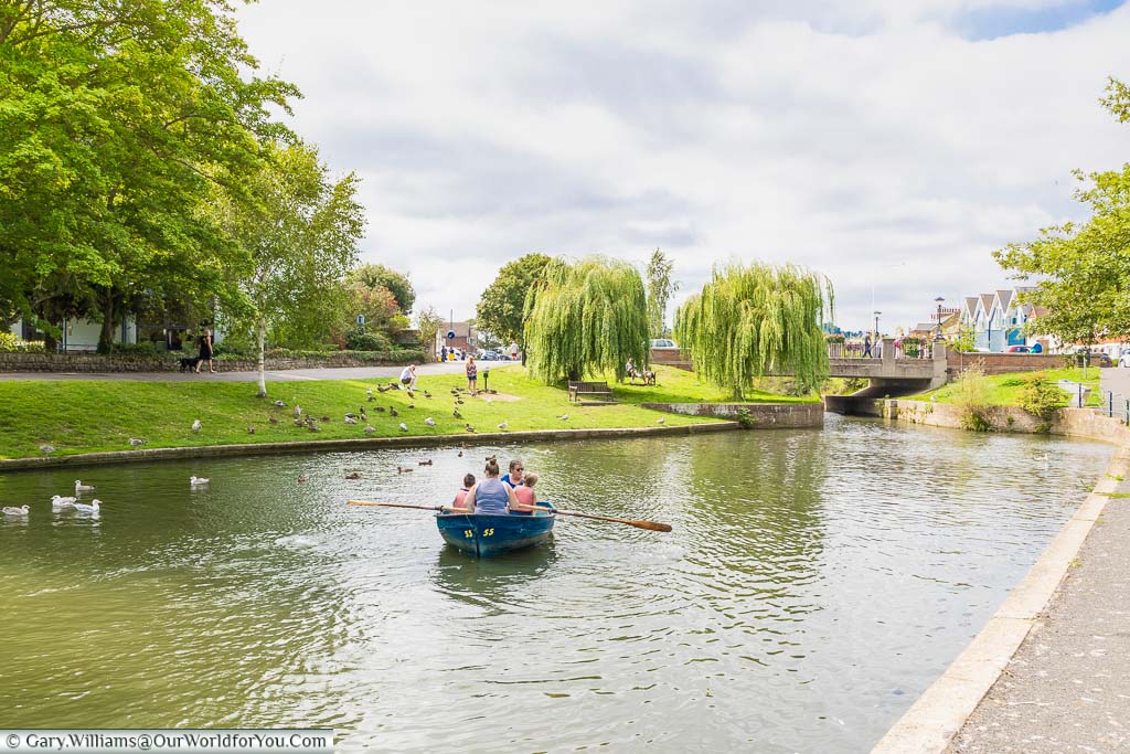 A family boating on the Royal Military Canal in Hythe, Kent