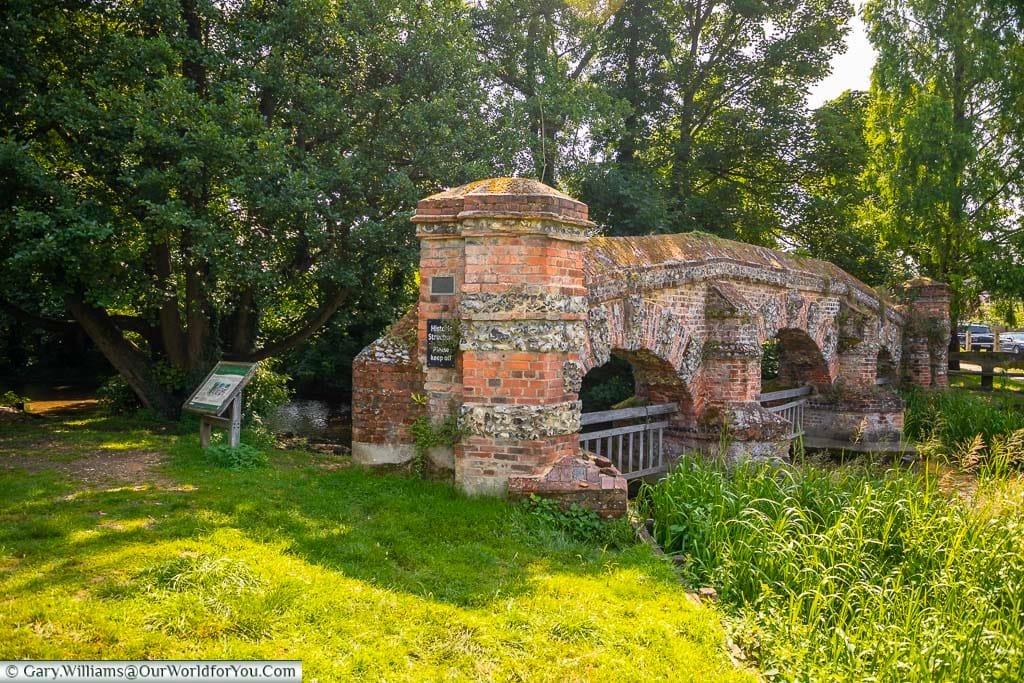 A side profile of the brick-built, three arch Cattle Screen folly over the River Darent in Farningham, Kent