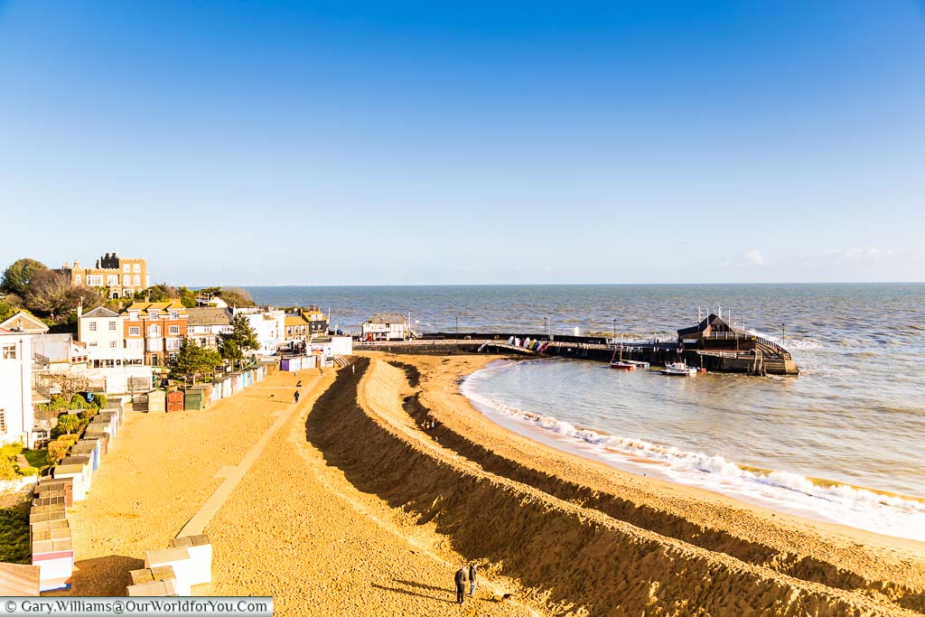 Looking over the Golden sands of Viking Bay in Broadstairs towards the Harbour arm where the sand on the beach group prepared for winter by creating a sandy break water