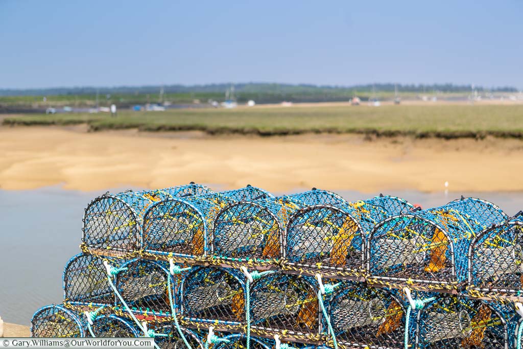 Shellfish baskets stacked up on the quayside of Wells-next-the-Sea on the North Norfolk coastline