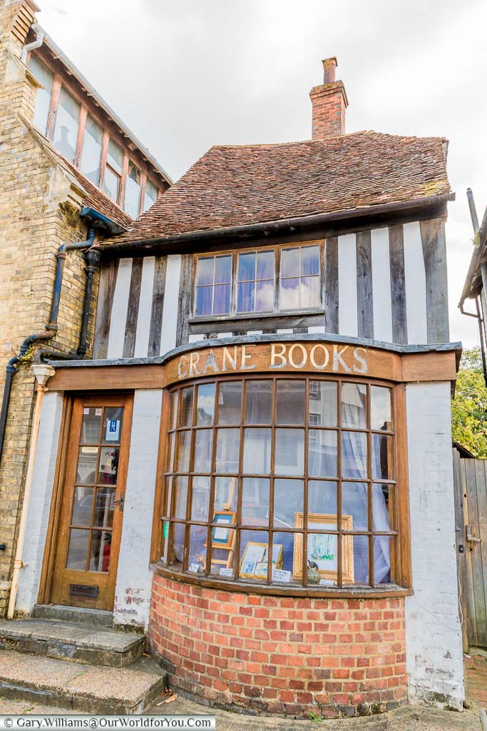 An intriguingly named shop called Crane Books, a play on words for the town's name of Cranbrook. The rather uneven shop shows the signs of age looking like a mix of styles from late Tudor to more modern times.