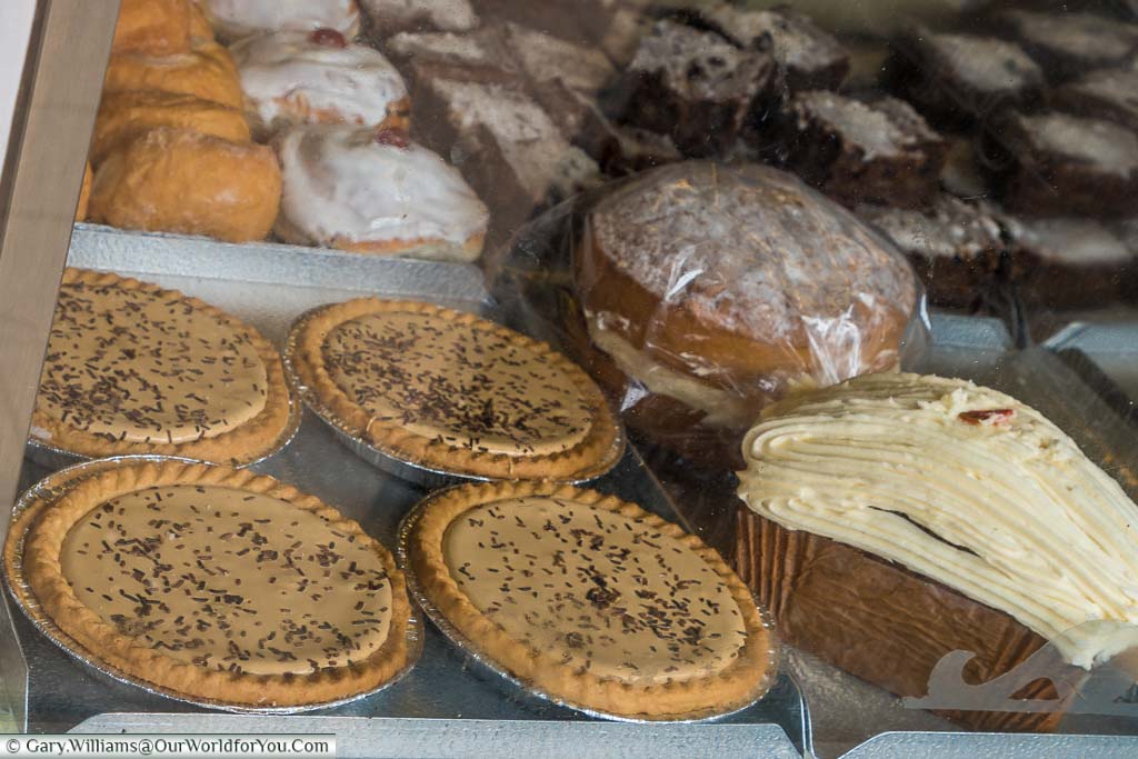 Four homemade gypsy tarts in the window of traditional bakers in Headcorn. Gypsy tarts of a local speciality of Kent.