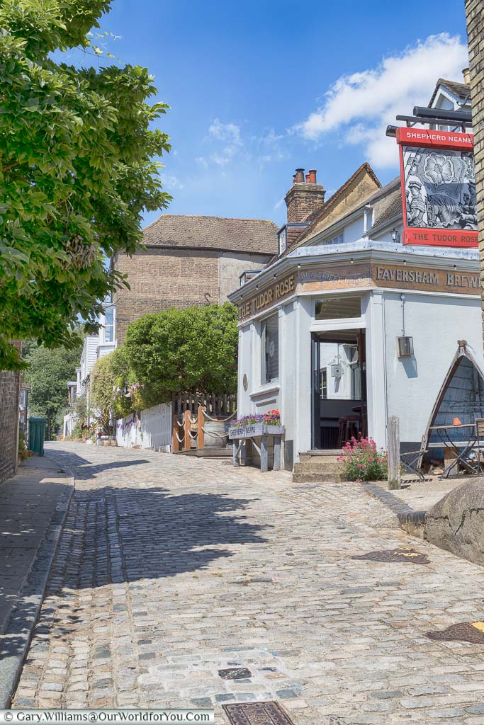 Looking up the cobbled high street of Upnor, the traditional Shepperd Neame Pub, the Tudor Rose, on the right-hand side.