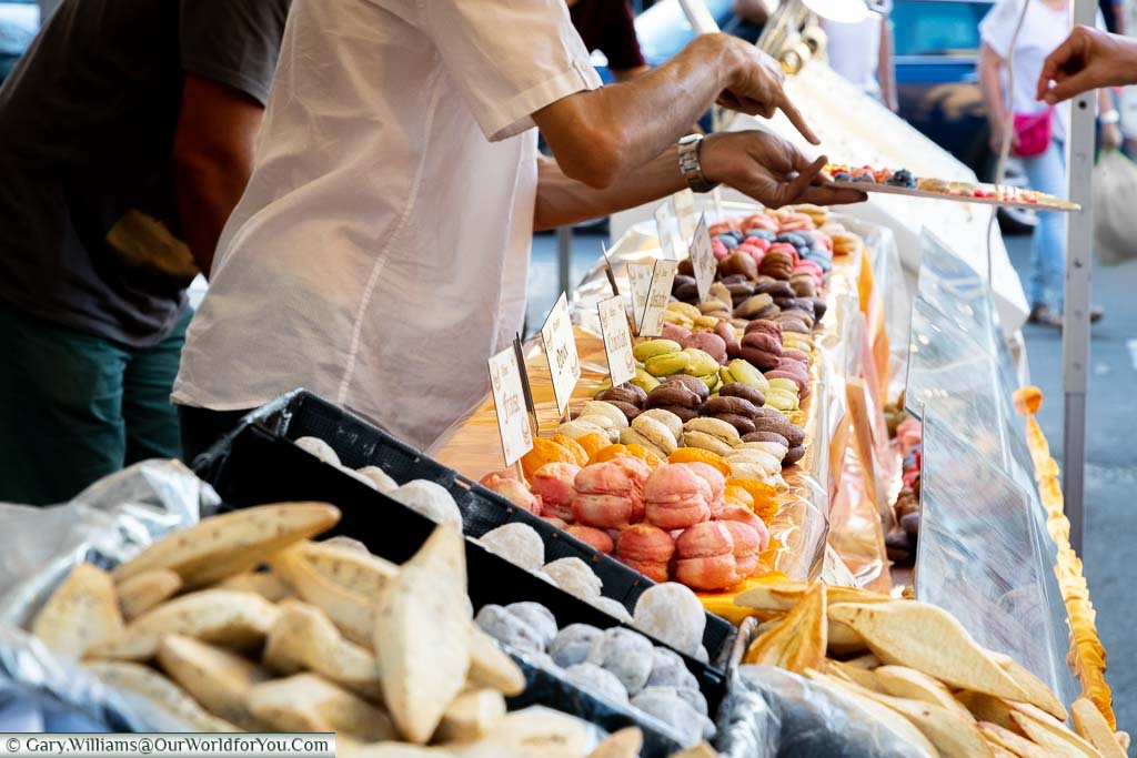 A close up the selection of macaroons on sale at the local market of Saint Remy de Provence