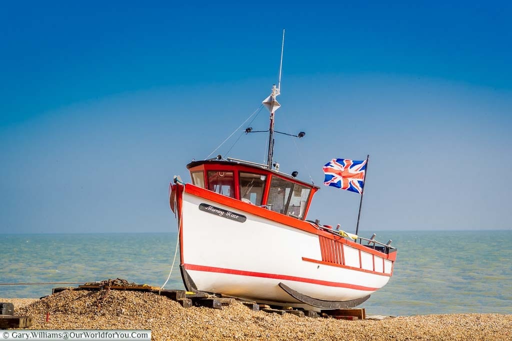 The Morning Haze small wooden fishing boat, flying the Union Jack, in the single beach of Deal