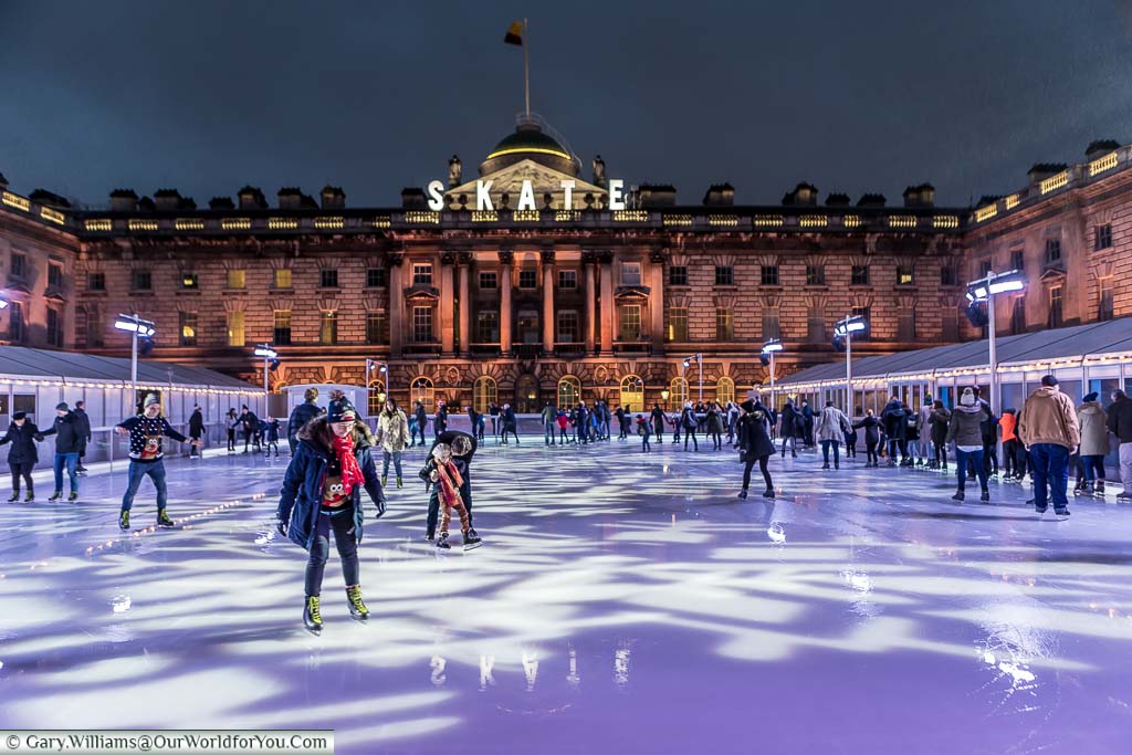 Skaters on the ice at London's Somerset house after the sun has gone down.
