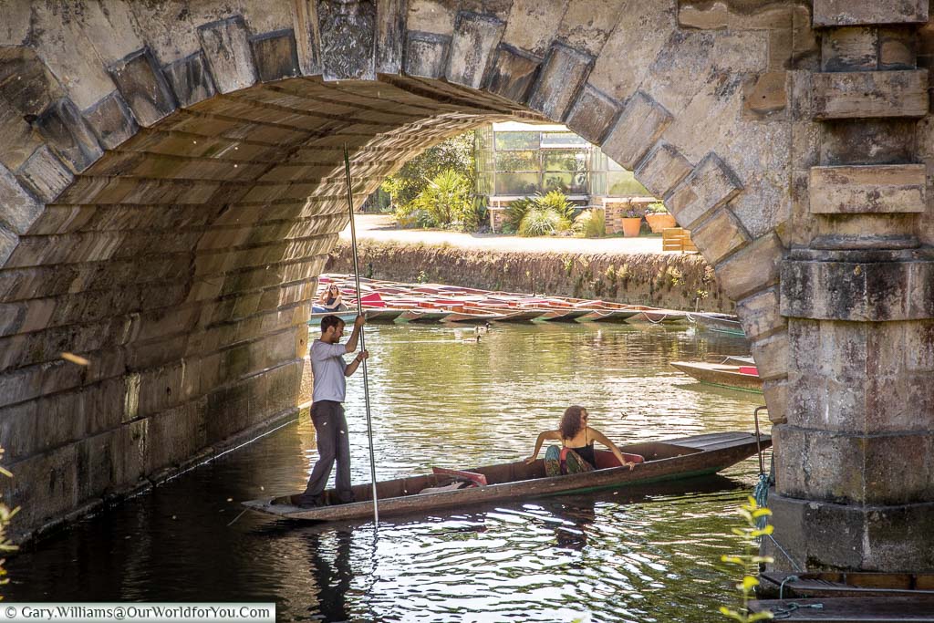 A punt on the River Cherwell under the Magdalen Bridge
