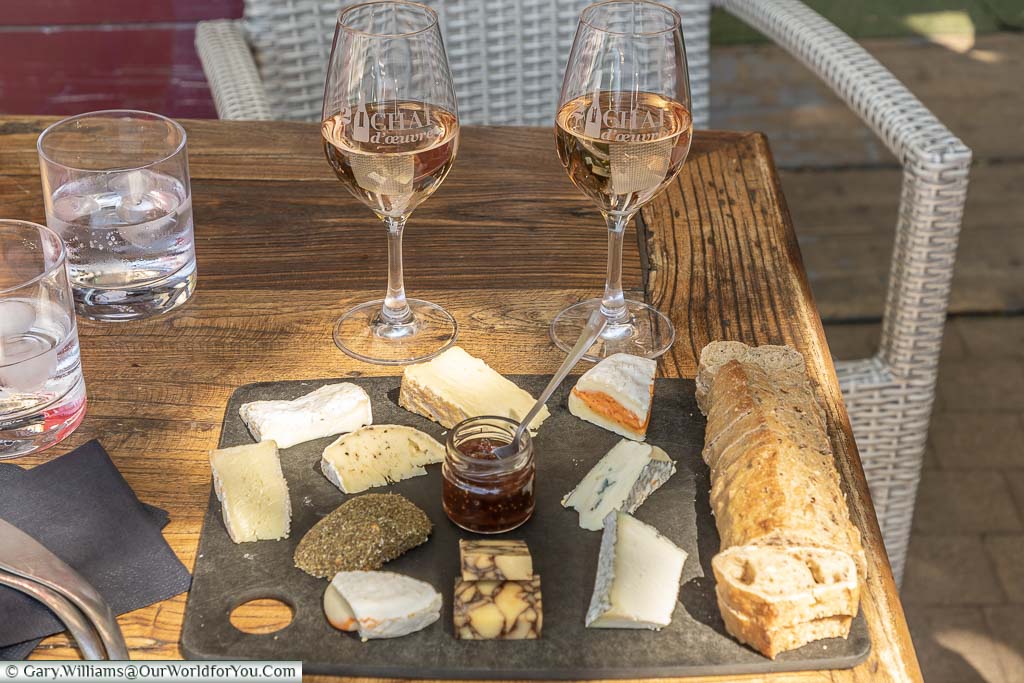 Enjoying 2 glasses of rose a wine and a cheese board with a selection of local produce and fresh bread with the chutney in the centre at St Remy de Provence.