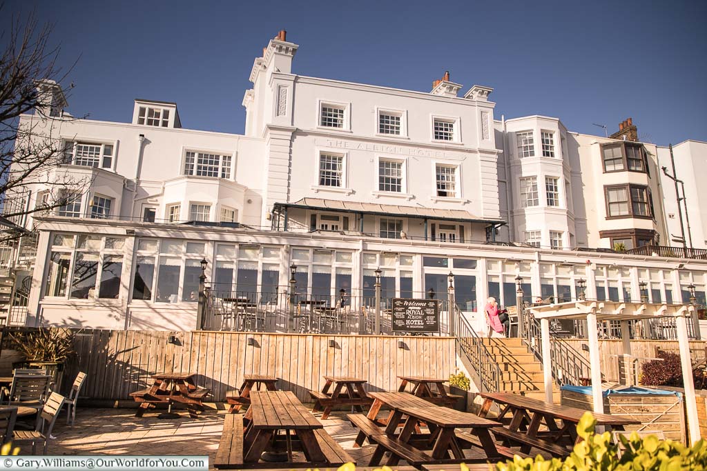 The rear of the Albion hotel with a glass covered conservatory and seating area that overlooks Viking Bay and the Kent coast.