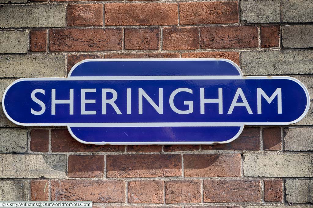 The platform sign for Sheringham Station on the North Norfolk Railway in the iconic white lettering on a mid-blue background.