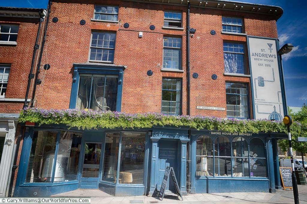 The outside of the St Andrews Brew House in Norwick with its mash tun visible in the window