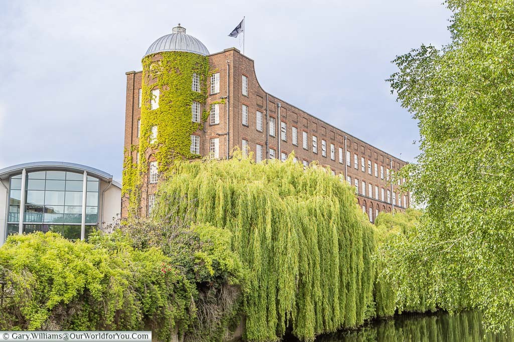 The large imposing brick-built St James Mill on the banks of the River Wensum in Norwich