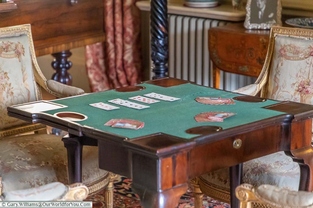 A close up of a card table in the Drawing Room of Ightham Mote