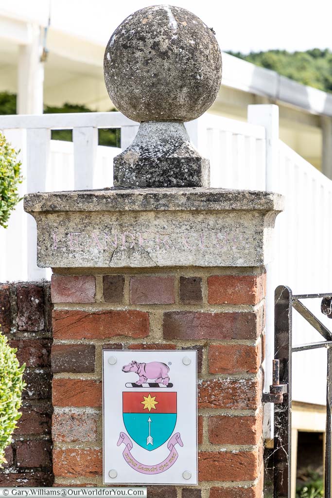 A brick-built pillar at the entrance to the Leander Rowing Club featuring the club's emblem