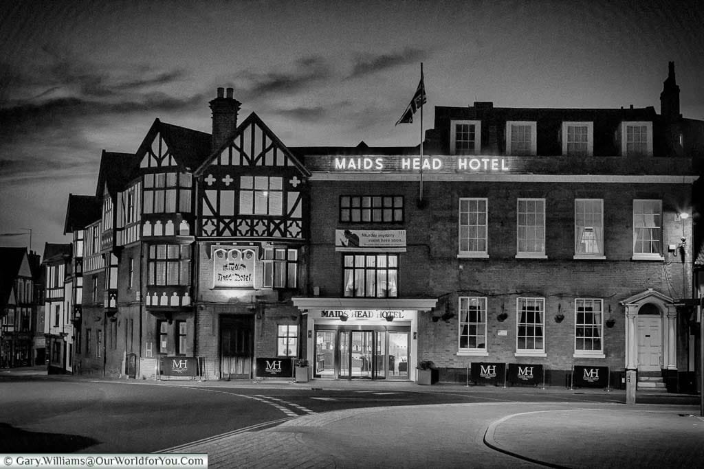 A black and white exterior image of our accommodation while in Norwich, The Maids Head Hotel