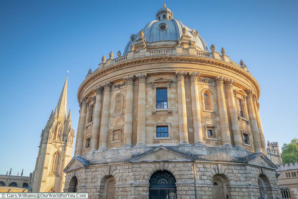 The Radcliffe Camera with the spire of the University Church of St Mary the Virgin in the background.