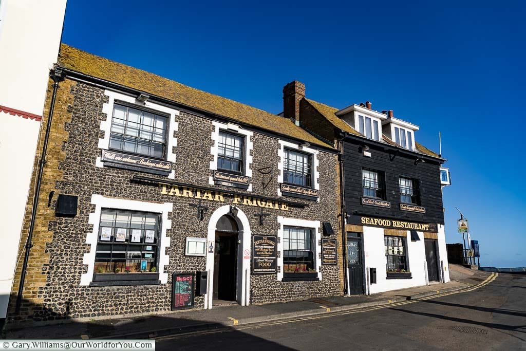 The Tartar Frigate pub and seafood restaurant at the entrance of Broadstairs Harbour on a bright, sunny, winter's day.