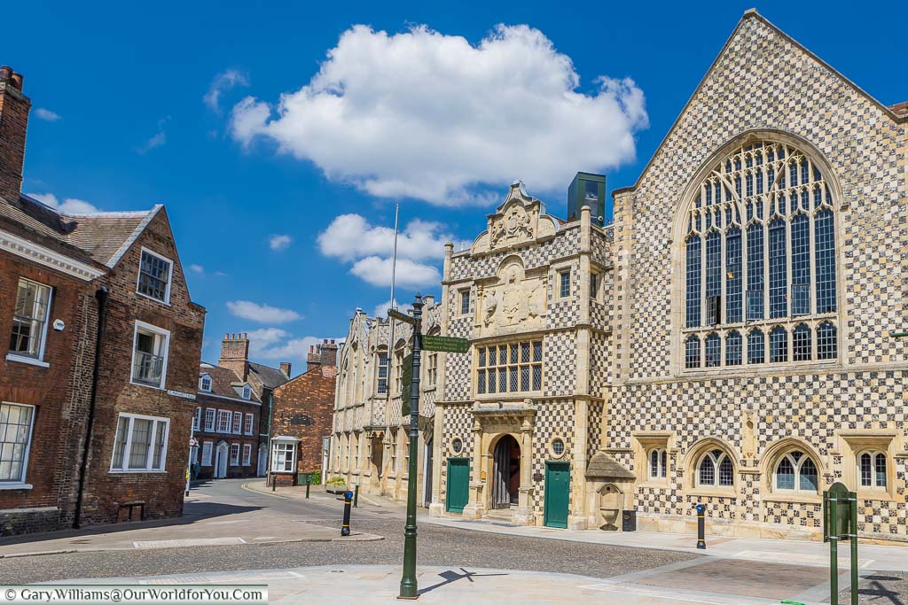 The chequerboard flint & yellow stone frontage of King's Lynn Town Hall & Trinity Guildhall.