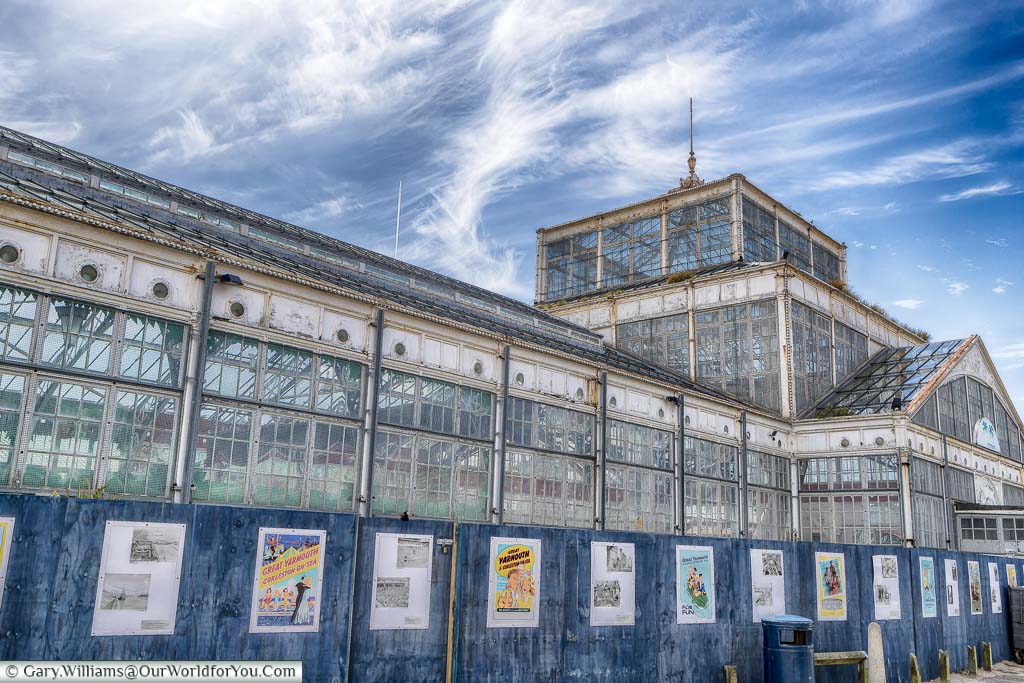 The wrought-iron & glass structure of the Winter Gardens behind hoarding as it awaits restoration.