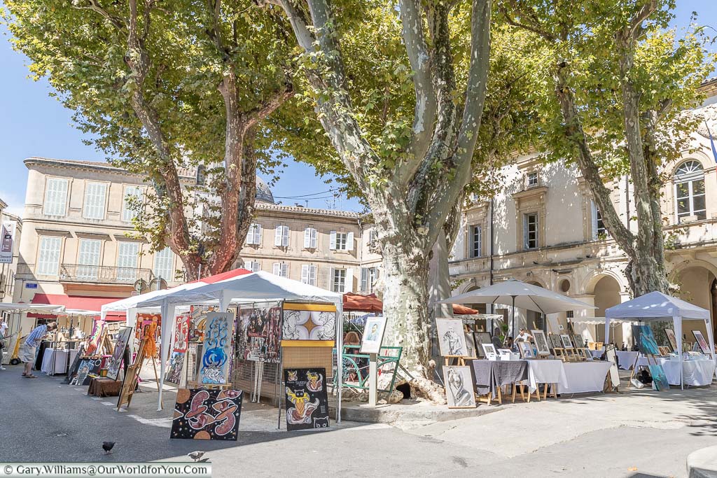 A collection of stalls at an art market in the town of St Remy-de-Provence.