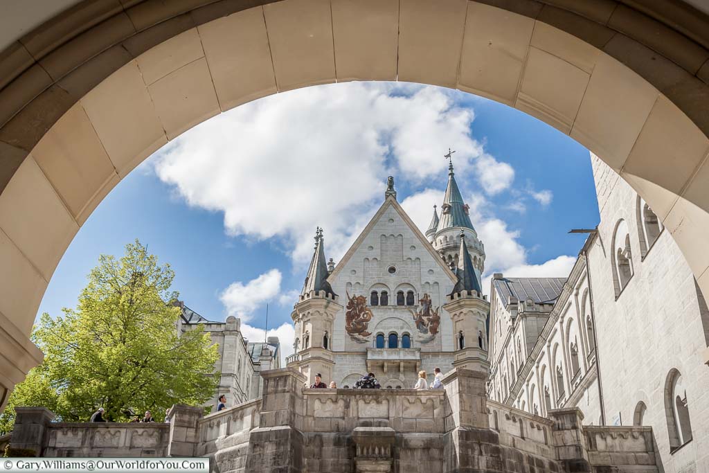 The view through the arch, at the entrance of the fairytale castle of Schloss Neuschwanstein, to the inner courtyard.