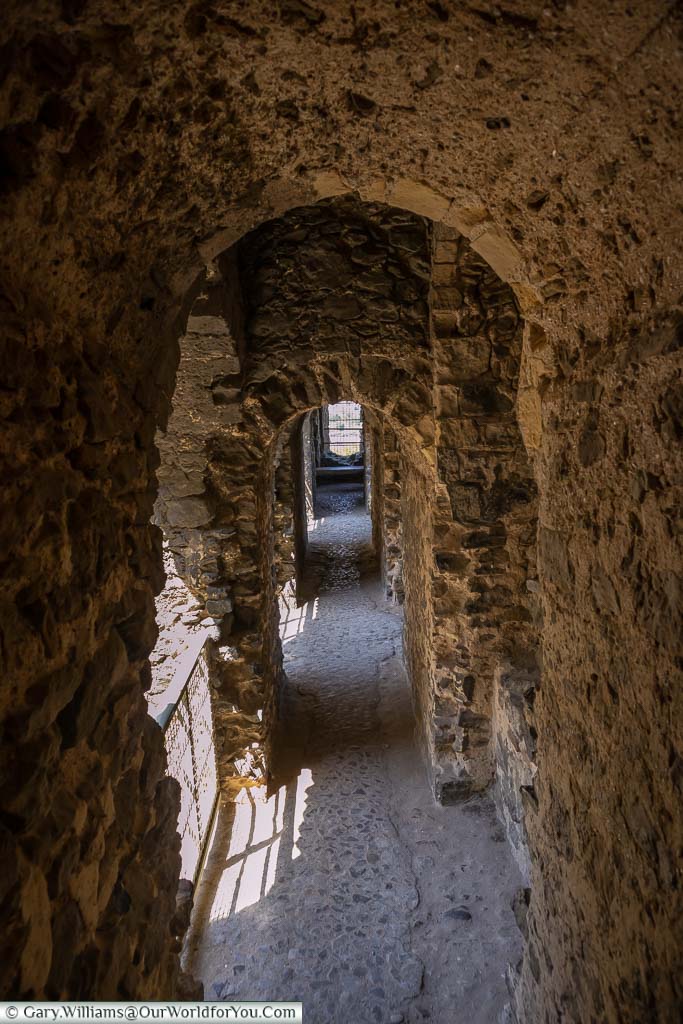 A narrow stone corridor within Rochester castle